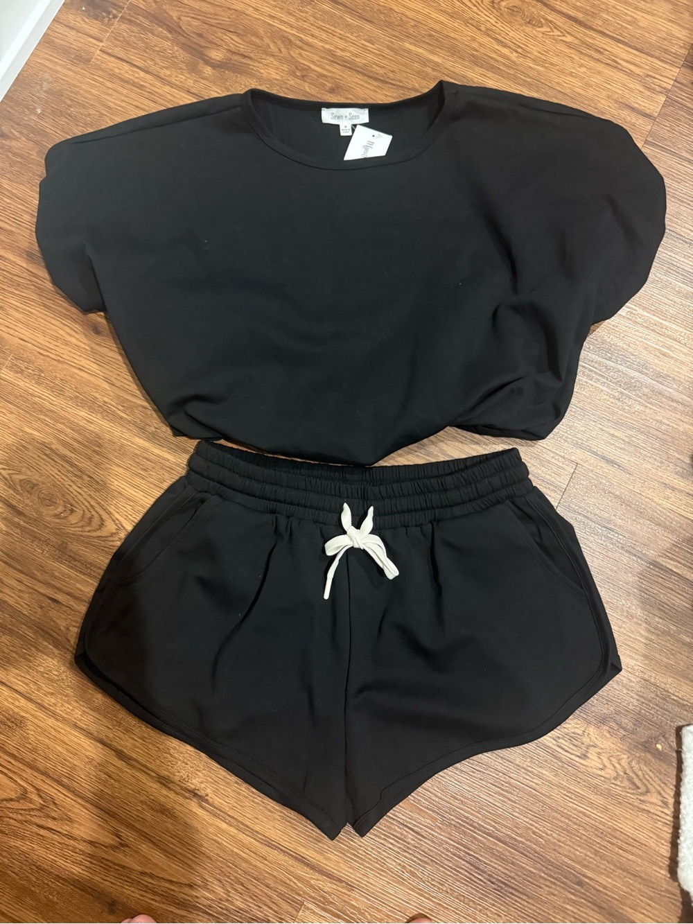 NWT Sewn & Seen Black Women's Knit Crop sweatshirt top and matching shorts set.